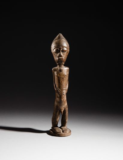 null Statue masculine Baoulé, Côte d'Ivoire
Bois à patine brun clair
H. 40 cm
Provenance...