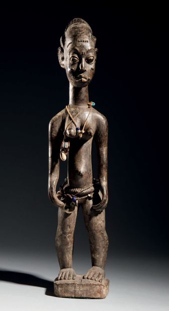null Statue féminine Baoulé, Côte d'Ivoire
Bois à patine brun clair, perles, cauris,...