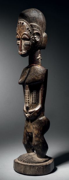 Baule female figure, Blolo Bla, Ivory Coast
Wood
H....