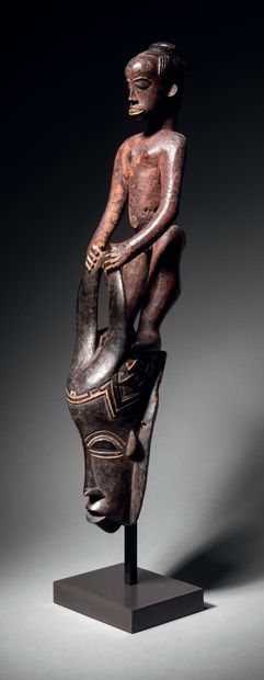 Ɵ Gouro mask surmounted by a figure, Ivory...