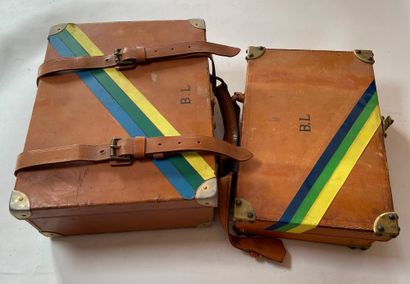 null Two leather cartridge cases, colored adhesive tape across. Monogrammed B.L....