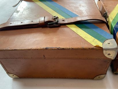 null Two leather cartridge cases, colored adhesive tape across. Monogrammed B.L....