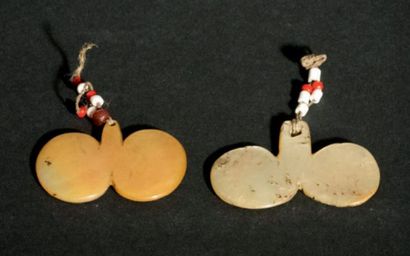 null Pair of ear ornaments Bawisak
Ilongot/Kalinga
Mother-of-pearl, red and white...