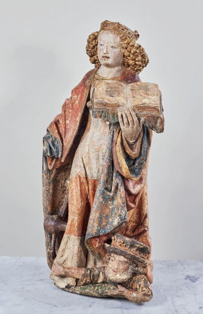  Sainte Catherine d'Alexandrie en pierre calcaire polychromée et dorée. La sainte...