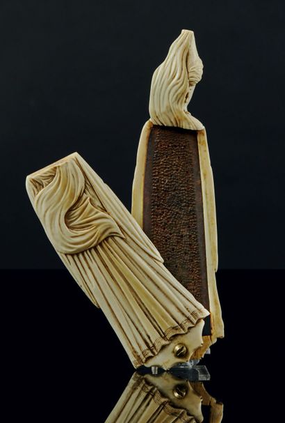 null 
Finely carved ivory tobacco rasp representing an oriental woman with a turbaned...