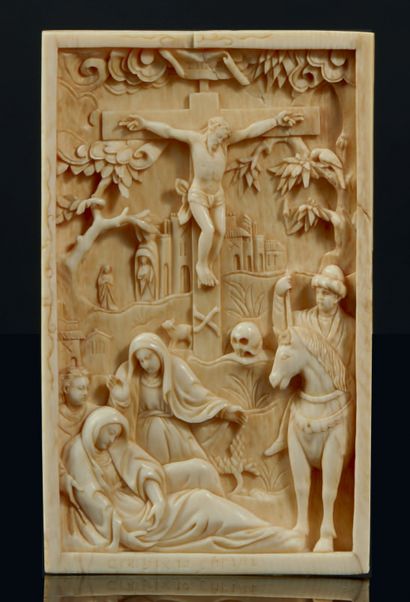  Ivory plaque carved in high relief representing...