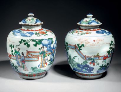 CHINE 
Pair of covered porcelain pots with polychrome wucaï decoration of women and...