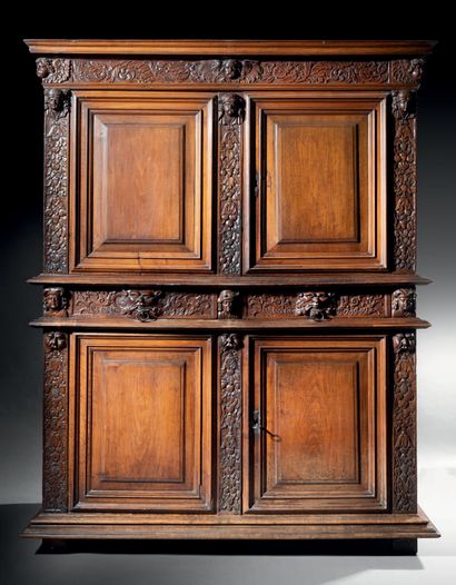 Walnut cabinet opening to four doors and...