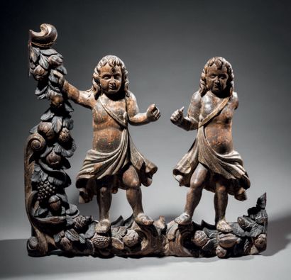 null Wood carved in high relief, polychromed and gilded, representing two children...