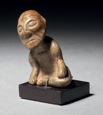 
Ɵ Olmec seated figure of an old man, Mexico,...