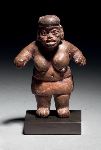 
Ɵ Olmec bear-breasted female figure, Mexico,...