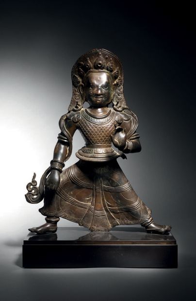null Bhimsen, Népal, 19e siècle H. 45 cm. Alliage de cuivre
Bhimsen se tient debout...