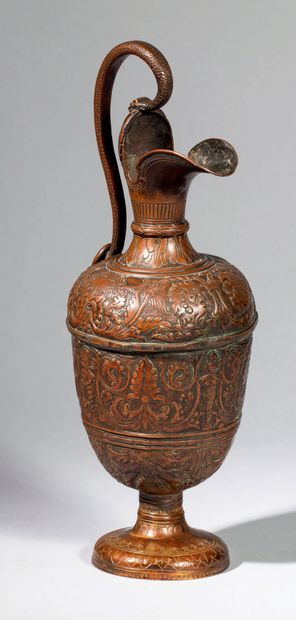 Ewer in embossed and engraved copper. Body...