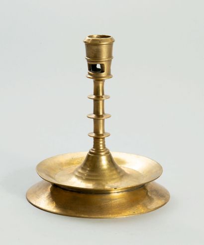 Large brass candlestick. Cylindrical stem...