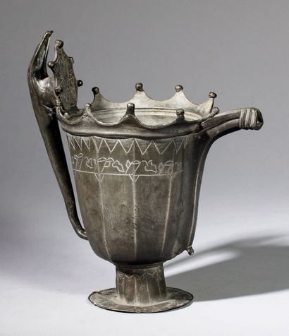 null Amazing pewter ewer. The decagonal body rises on a pedestal on a circular base....