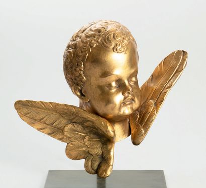 Beautiful cherub's head in chased and gilded...