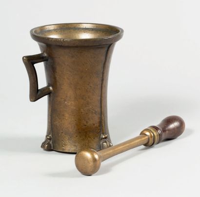 null Large bronze mortar of flared form with a square socket; body with four thin...