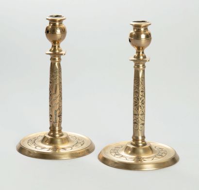 Pair of bronze candlesticks with engraved...