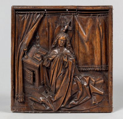 Walnut panel carved in high relief representing...