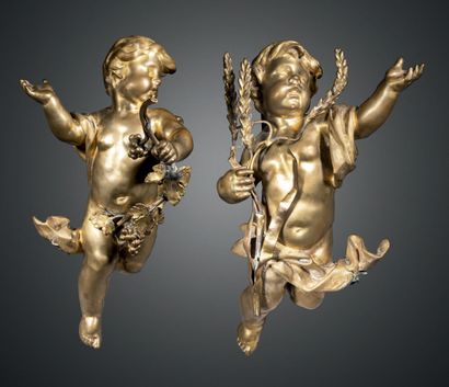 null Pair of cherubs in chased and gilded bronze symbolizing autumn and summer, one...