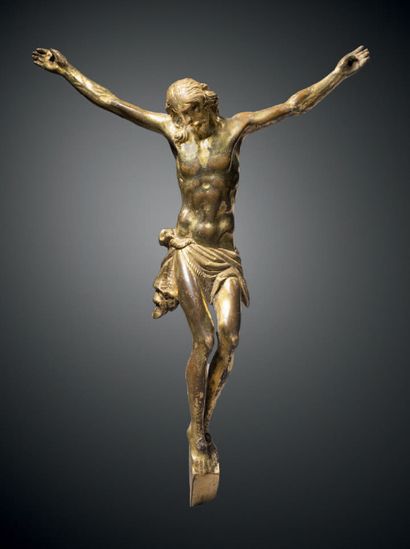Christ en bronze ciselé et doré. Tête à la...
