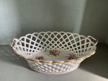 Paris Two oval openwork porcelain baskets with polychrome decoration of bouquets...