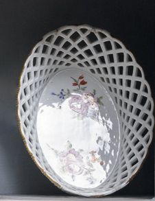 Paris Two oval openwork porcelain baskets with polychrome decoration of bouquets...