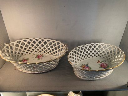 Paris Two oval openwork porcelain baskets with polychrome decoration of bouquets...