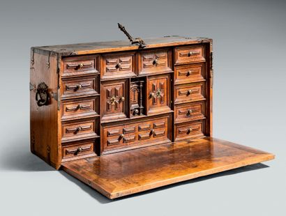 null Bargueño in walnut opening by a flap on numerous drawers and two small leaves,...