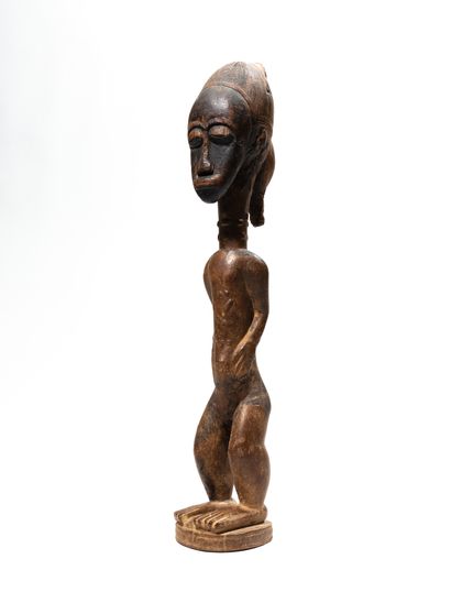 null Baule statue, Ivory Coast
Wood
H. 44 cm
Ancient statue representing a male figure...