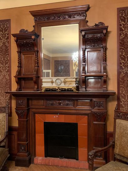null Mantel with walnut overmantel carved with foliage
Decorated with volutes and...