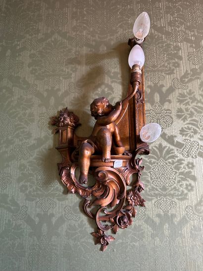 null Pair of wall sconces with three light arms in regule with asymmetrical decoration...