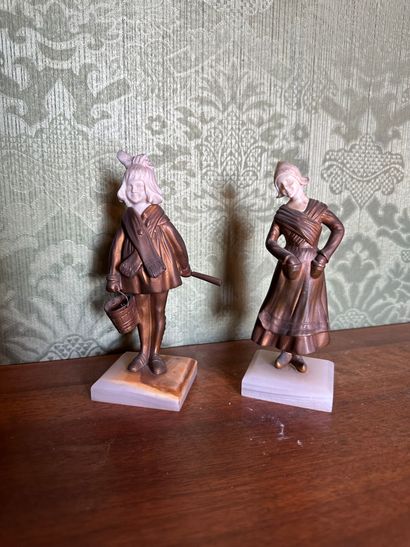 Deux statuettes en bronze doré et ivoire...