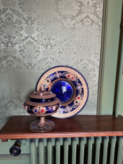 null Beautiful covered cup and its tray in cobalt blue glass on pedestal decorated...