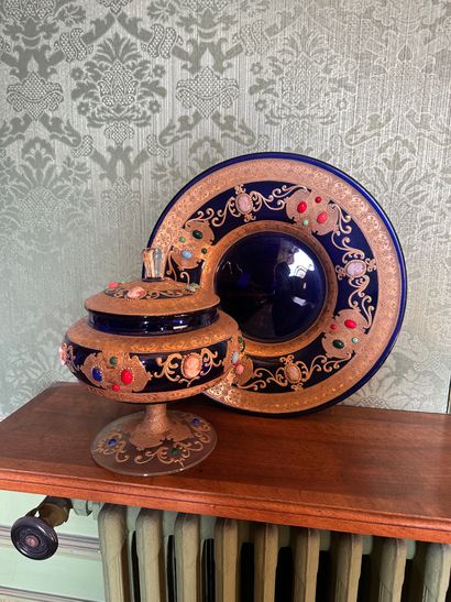 null Beautiful covered cup and its tray in cobalt blue glass on pedestal decorated...