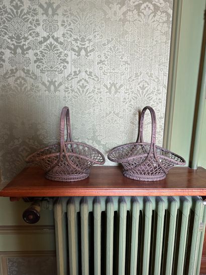 null Pair of silver plated fruit baskets simulating wicker baskets with handles.
H....