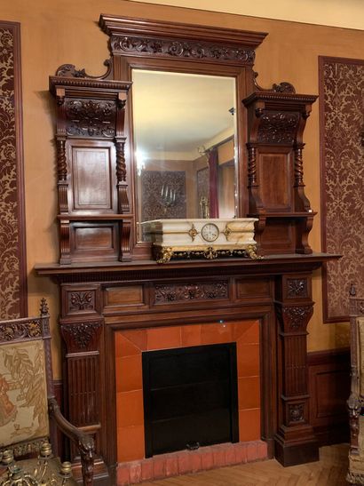 null Mantel with walnut overmantel carved with foliage
Decorated with volutes and...