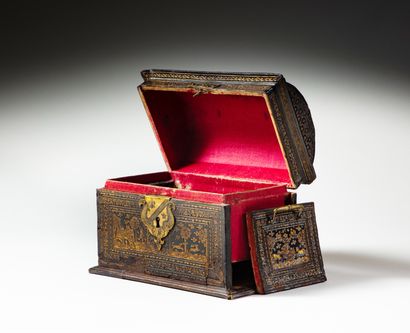 null Wooden core box covered with chased and gilded leather, domed lid, top handle,...
