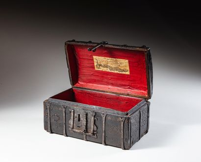 null Wooden case covered with chiseled leather decorated with scales, quatrefoils,...
