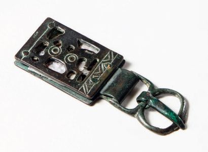 null Openwork bronze buckle plate decorated with a horse on a mica background.
Merovingian...