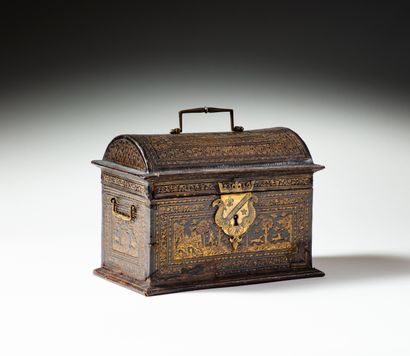 null Wooden core box covered with chased and gilded leather, domed lid, top handle,...