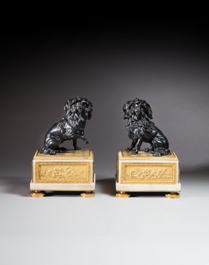 null Pair of chased and patinated bronze and white marble groups in the form of barbets...