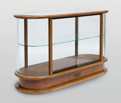 Low display case in natural wood, opening...