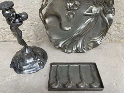 null Pewter lot including :
A vacuum cleaner and a candlestick
In the Art Nouveau...