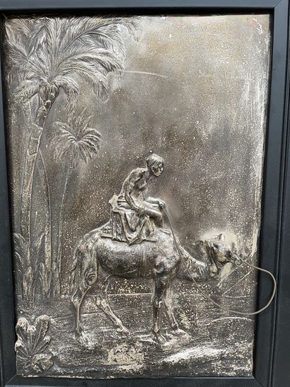 null Man on a camel under the palm trees
Silver plated chased metal painting
38 x...