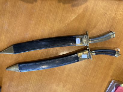 null Pair of hunting daggers
In brass, metal and wood
Leather scabbard and brass...