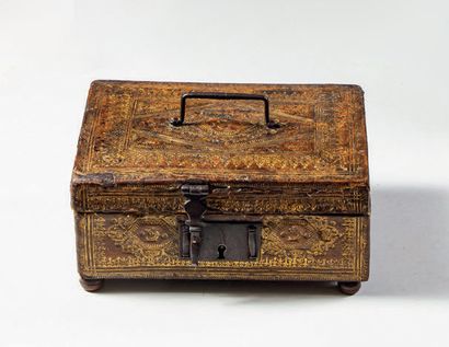 Wooden case covered with gilded leather,...