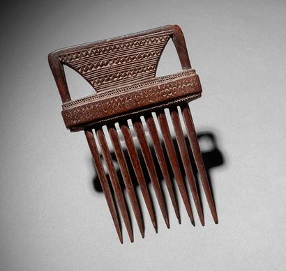 Comb
Wood with brown patina
H. 14.5 cm

Comb
H....
