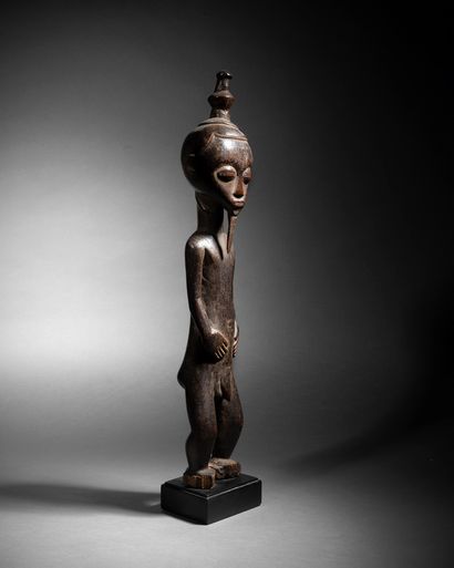 Baule male figure
Ivory Coast
Wood with patina...