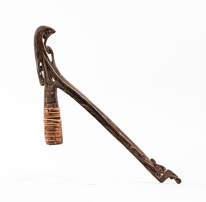 null Adze 
Massim, Papua New Guinea
Carved wood, rattan
H. 66.5 cm

This light wood...